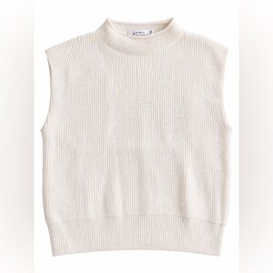 White sleeveless mockneck sweater